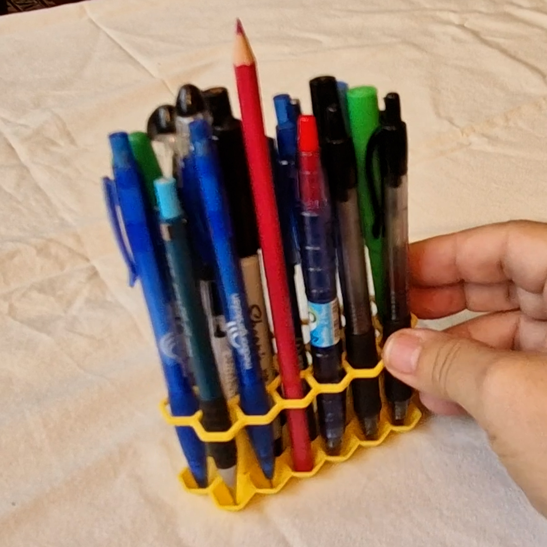 Tan ”rectangular” Hexagonal leaning Pen holder, slightly angeled pen positions.